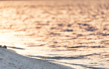 Fototapeta na wymiar Close up shot of Salda Lake sand view on sunset with water and shallow dof.