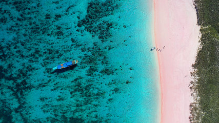 aerial overhead shot of pink beach with crystal clear water in indonesia komodo islands