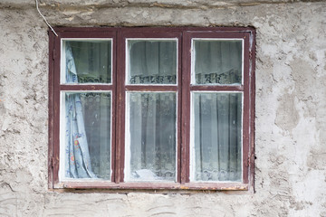 Old wooden window looks in the new world.