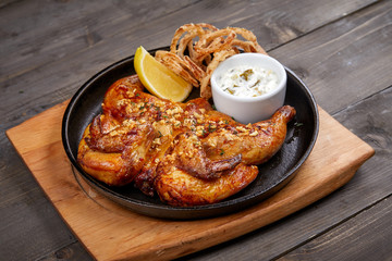 roasted chicken with sauce and lemon