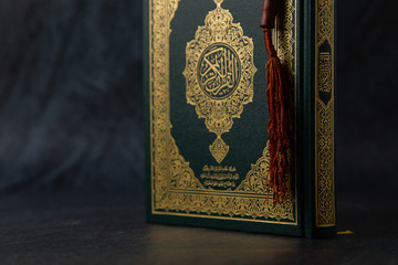 Quran - holy book of Muslims religion, Concept: open book holy prayers for god,  Friday In the month of Ramadan  religion Islamic worshiping faith and learn koran and rosary put on wooden  boards 
