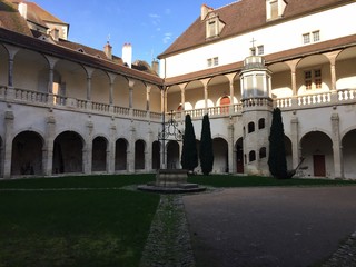 Fototapeta premium The Hôtel-Dieu building and park in Dole's old town, France.