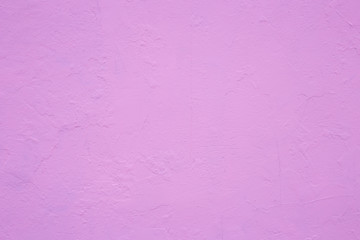 cement wall painted in shades of pink