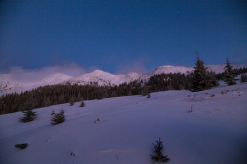 Winter landscape in the higest Carpahian mountains near Yaremche in the sunset