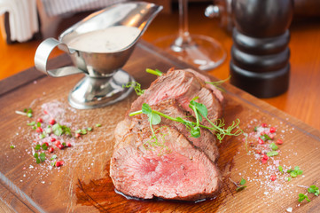 juicy beef steak with medium well with white sauce
