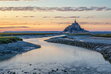 Mont-Saint-Michel is the name of a tidal island located off the coasts of Normandy and Brittany, near the mouths of the Couesnon - obrazy, fototapety, plakaty
