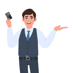 Young businessman showing credit, debit card and presenting/pointing hand to copy space. Person in waistcoat holding ATM card. Man introducing something. Character illustration in vector cartoon.