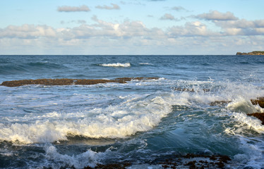waves breaking on beach