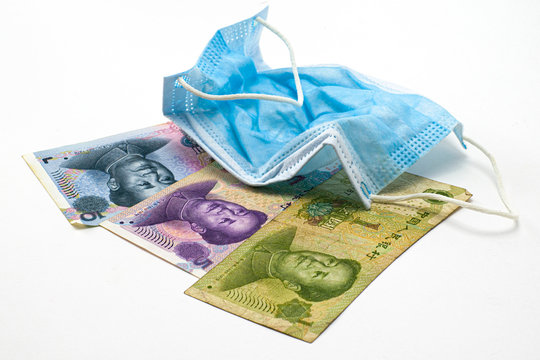 the concept coronovirus and economy of china chinese yuan money lie near medical hygiene mask