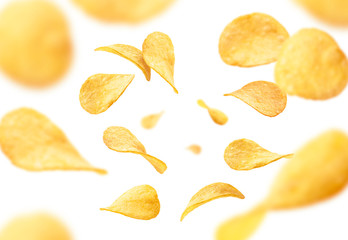 Fototapeta Potato chips levitate on a white background obraz