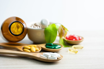 Alternative medicine, pills tablet, capsule and vitamin organic supplements good for health in wood...