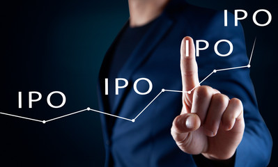 Businessman presses button Iipo Initial Public Offering network on chart