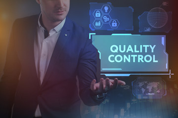 Business, Technology, Internet and network concept. Young businessman working on a virtual screen of the future and sees the inscription: Quality control