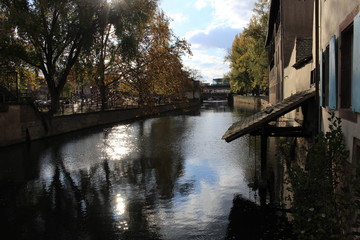 Fototapeta premium Traditional Alsatian timber framed houses on the banks of River Ill in Petite France, Strasbourg, France.