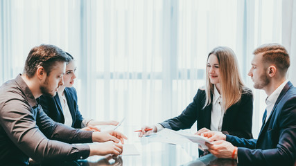 Partnership and negotiation. Business people discussing cooperation conditions at modern conference room.