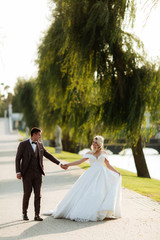 Bride and groom in forest on their wedding, photo session.