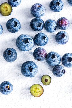 Fresh blueberries in the summer sun with water droplets
