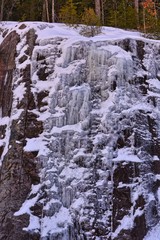 Fototapeta na wymiar frozen waterfall on rocks