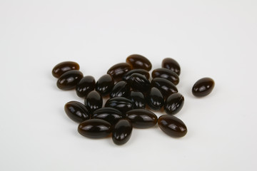 Hemp, cannabis cbd oil bottle and capsules on white background