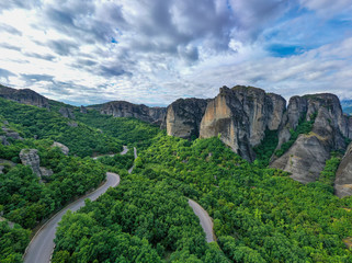 Legendary aerial drone view of ancient monasteries and breathtaking picturesque valley and landmark canyon of Meteora, Greece