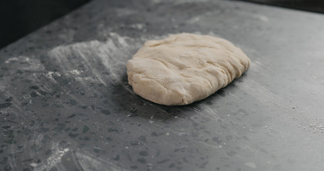 dough in process on concrete countertop