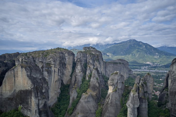 Legendary aerial drone view of ancient monasteries and breathtaking picturesque valley and landmark canyon of Meteora, Greece, Unesco