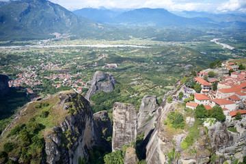 Legendary aerial drone view of ancient monasteries and breathtaking picturesque valley and landmark canyon of Meteora, Greece, Unesco