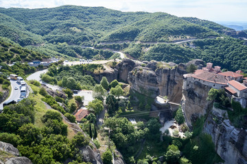 Legendary aerial drone view of ancient monasteries and breathtaking picturesque valley and landmark canyon of Meteora, Greece, Unesco