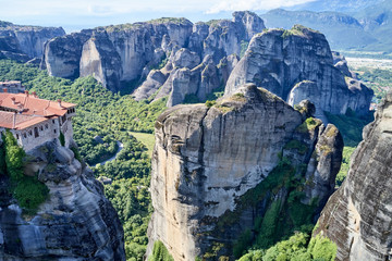 Legendary aerial drone view of ancient monasteries and breathtaking picturesque valley and landmark canyon of Meteora, Greece, Unesco