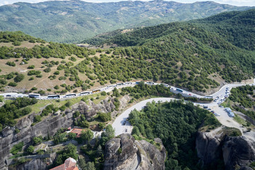Legendary aerial drone view of ancient monasteries and breathtaking picturesque valley and landmark canyon of Meteora, Greece, Unesco
