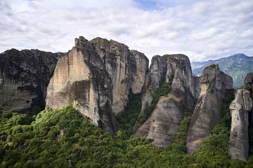 Fototapeta na wymiar Legendary aerial drone view of ancient monasteries and breathtaking picturesque valley and landmark canyon of Meteora, Greece, Unesco