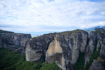 Legendary aerial drone view of ancient monasteries and breathtaking picturesque valley and landmark canyon of Meteora, Greece, Unesco