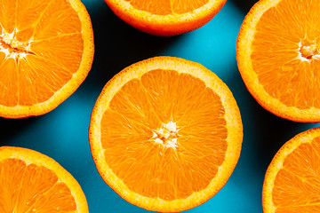 oranges in the cut on a blue background.