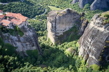 Legendary aerial drone view of ancient monasteries and breathtaking picturesque valley and landmark canyon of Meteora, Greece, Unesco