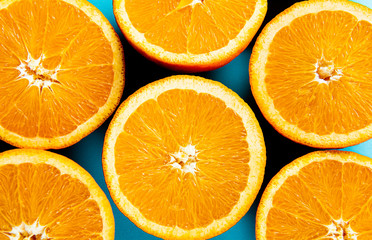 oranges in the cut on a blue background.