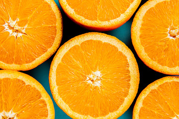 oranges in the cut on a blue background.