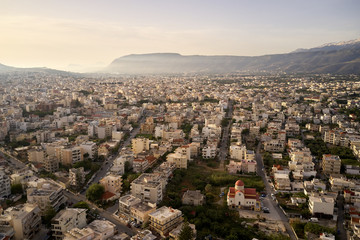 Fototapeta na wymiar Panoramic aerial view from above of the city of Chania, Crete island, Greece with white mountains, beautiful venetian town Chania in Crete island. Chania, Crete, Greece.