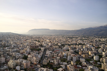 Naklejka premium Panoramic aerial view from above of the city of Chania, Crete island, Greece with white mountains, beautiful venetian town Chania in Crete island. Chania, Crete, Greece.
