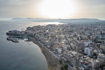 Panoramic drone aerial view from above of the city of Chania, Crete island, Greece. Landmarks of Greece, beautiful venetian town Chania in Crete island. Chania, Crete, Greece.