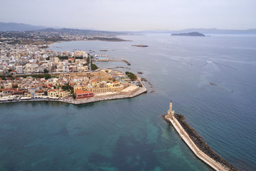 Obraz premium Panoramic drone aerial view from above of the city of Chania, Crete island, Greece. Landmarks of Greece, beautiful venetian town Chania in Crete island. Chania, Crete, Greece.