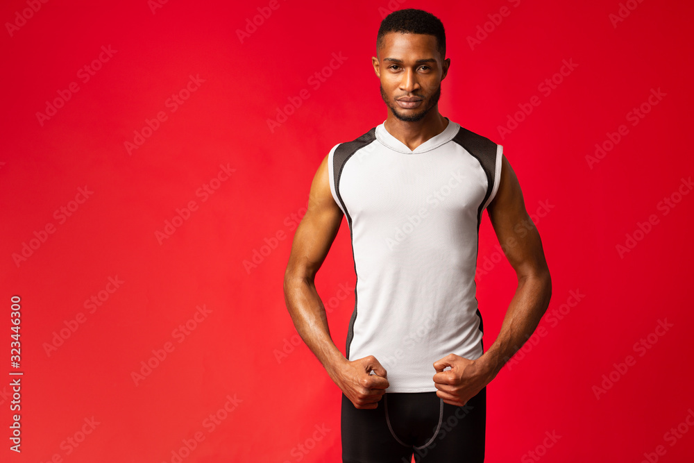 Poster afro sportsman standing in stance at studio