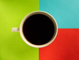 cup of coffee on a multi-colored background