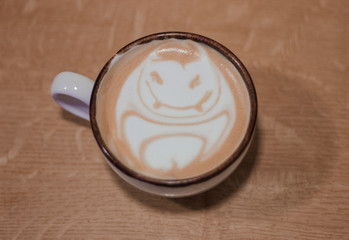 Сup of coffee on wooden table