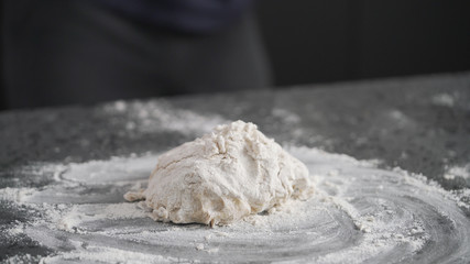 dough in process on concrete countertop