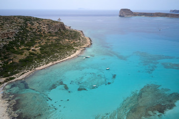 Fototapeta premium Amazing aerial drone top panoramic view on the famous Balos beach in Balos lagoon and pirate island Gramvousa. Place of the confluence of three seas. Balos beach, Chania. Crete island. Greece. Europe.