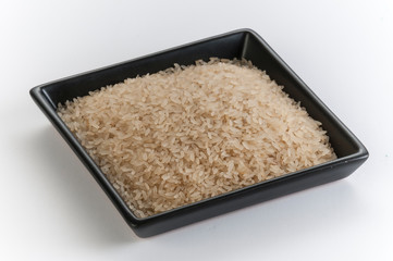 raw rice grains  in a plate