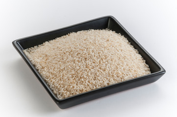 raw rice grains  in a plate