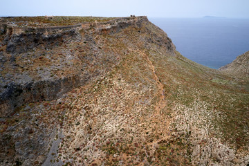 Aeial top view drone shot of Gramvousa island near Crete, Greece. Balos beach. Magical turquoise waters, lagoons, beaches of pure white sand