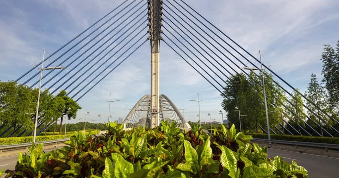Time lapse of the Seri Saujana Bridge in Putrajaya, Malaysia the Malaysian  Government city 40 km outside of Kuala Lumpur. Pan Tilt time lapse of the cable stayed bridge from the middle of the road