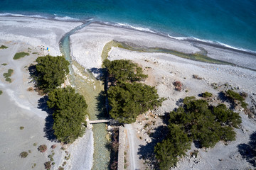 Aerial drone view of Agia Roumeli beach in Chania of Crete, Greece. The village of Agia Roumeli is...